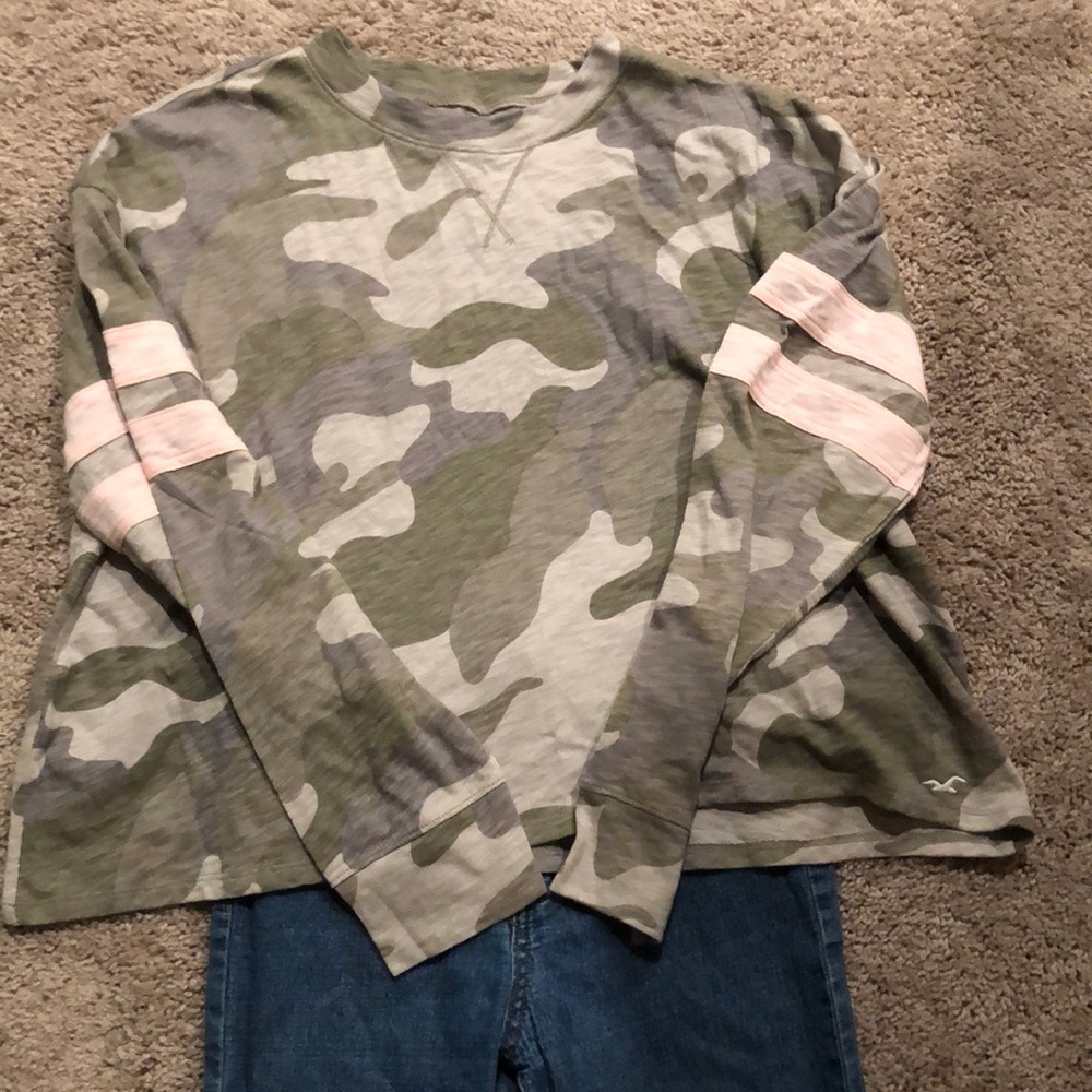 Gently used Camouflage shirt with blue jeans
